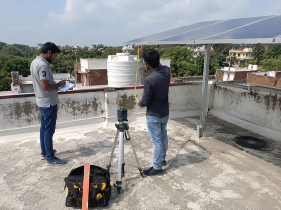 Site survey in progress with measuring equipment on a rooftop